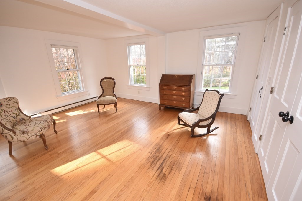 344 Flat Hills Road Amherst, MA 01002 - Photo 23 of 42 a living room with furniture and a wooden floor