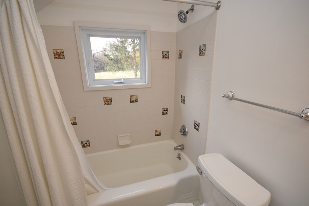 344 Flat Hills Road Amherst, MA 01002 - Photo 30 of 42 a white bath tub sitting next to a toilet