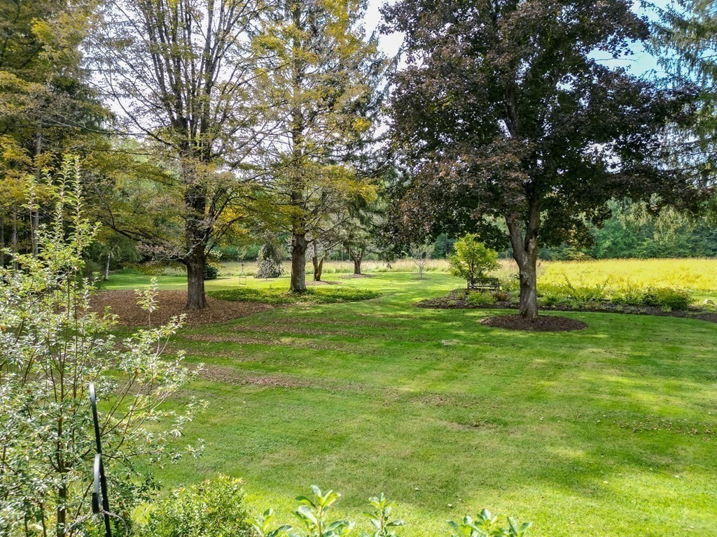 344 Flat Hills Road Amherst, MA 01002 - Photo 33 of 42 a view of grassy field with benches