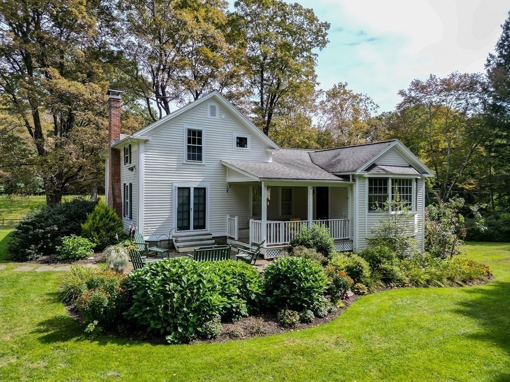 344 Flat Hills Road Amherst, MA 01002 - Photo 41 of 42 a front view of house with yard and green space