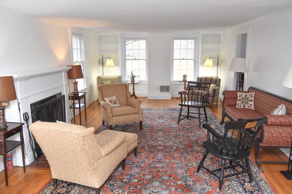 344 Flat Hills Road Amherst, MA 01002 - Photo 10 of 42 a living room with fireplace furniture and a large window