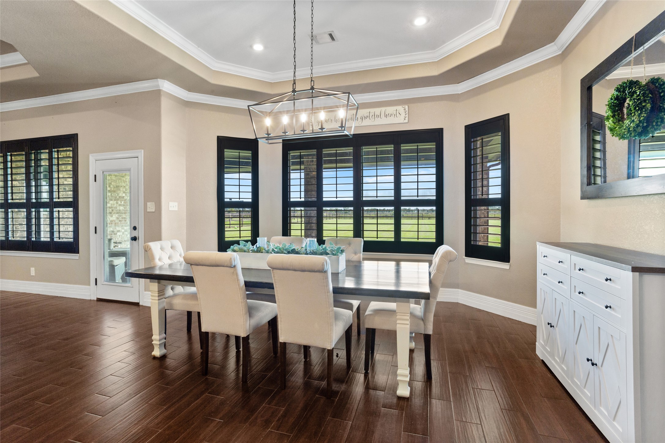 7842 Pebble Hill Lane Rosharon, TX 77583 - Photo 14 of 33 a view of a dining room with furniture wooden floor and chandelier