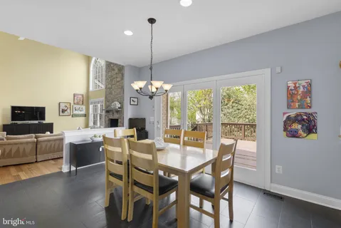 a view of a room with furniture and wooden floor