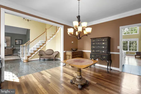 a bedroom with a bed and a chair