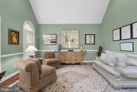 a bedroom with a bed dresser and a window