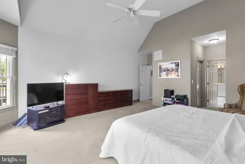 a living room with furniture and flat screen tv