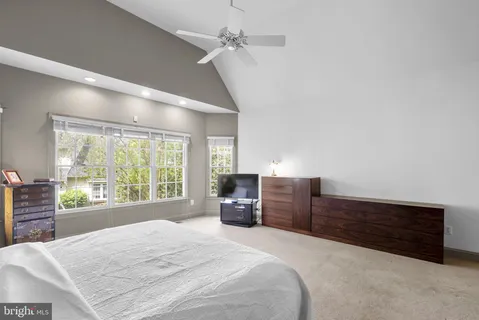 a bedroom with a bed and dresser
