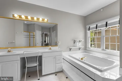 a bathroom with a shower a sink and a mirror