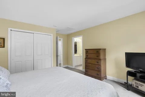 a bedroom with a bed and furniture