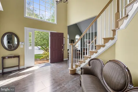 a view of an entryway with wooden floor