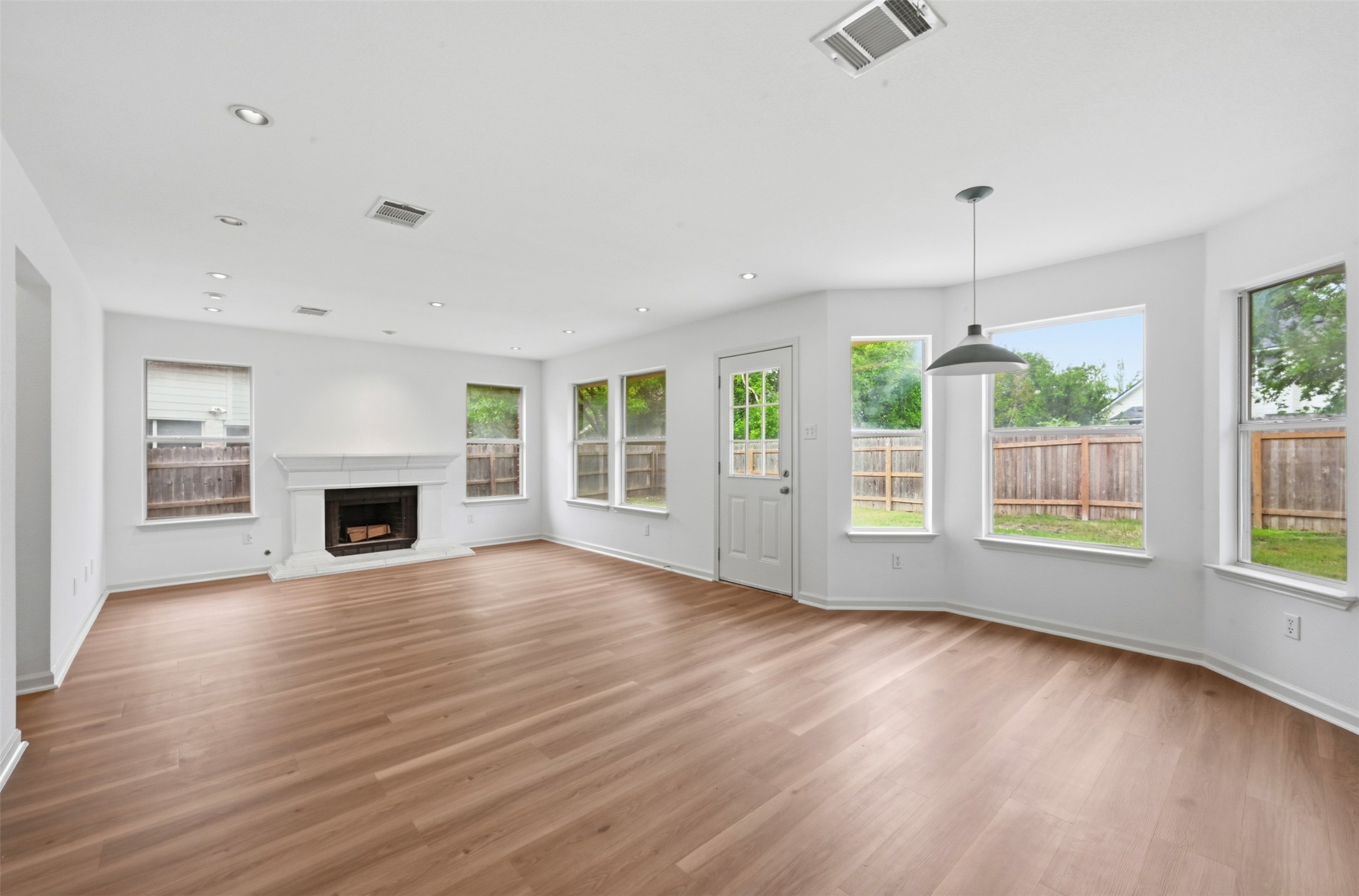 3629 Ruby Red Drive Austin, TX 78728 - Photo 8 of 35 2nd Living room with a fireplace with raised hearth and recessed lighting