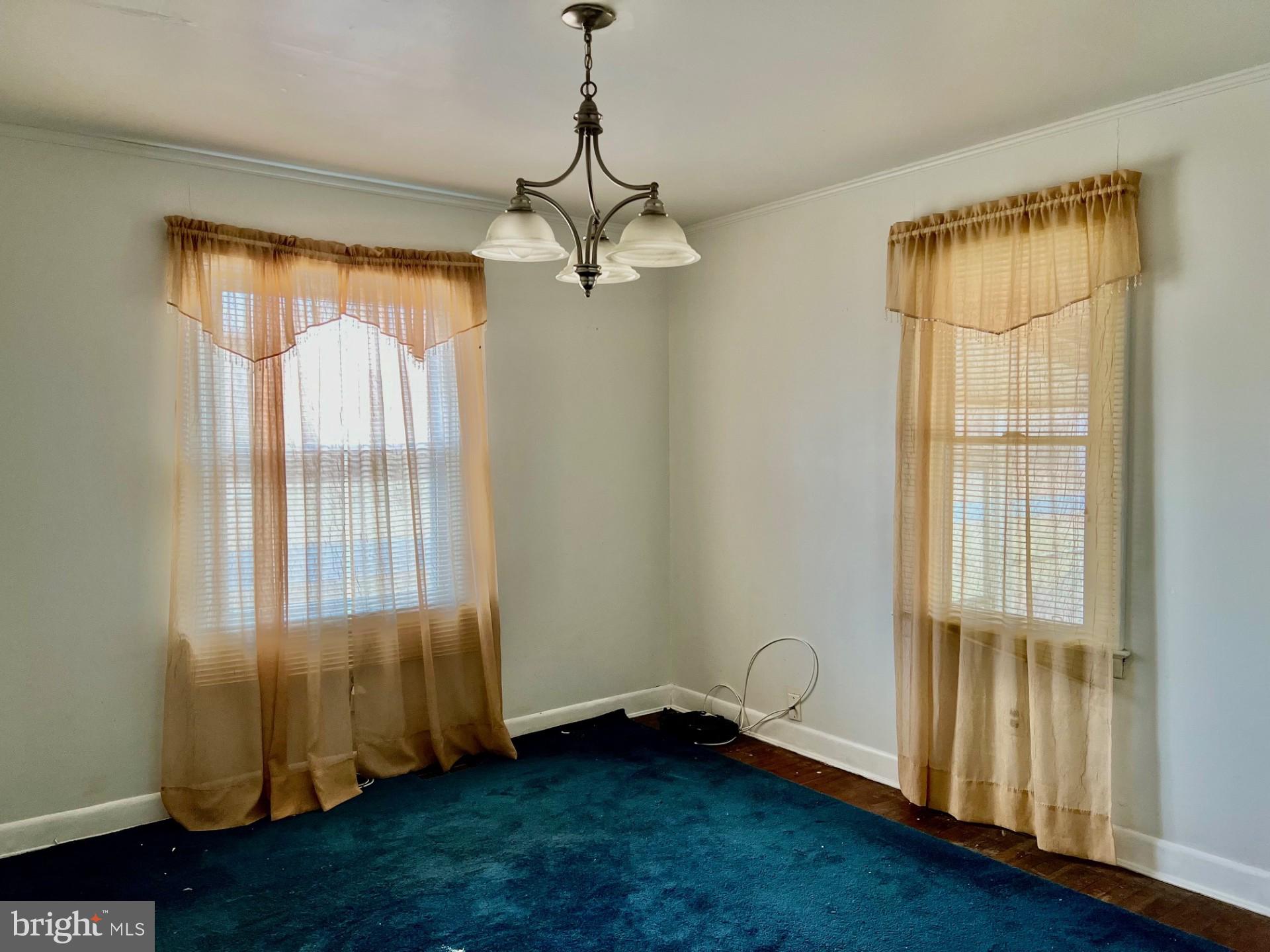 2708 Bank Road Nanticoke, MD 21840 - Photo 8 of 19 a view of an empty room with a window and wooden floor