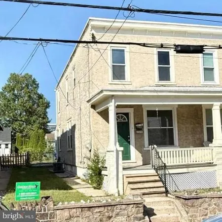 a view of a house with a window and wooden floor