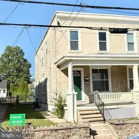 a view of a house with a window and wooden floor