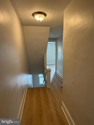 a view of entryway with wooden floor