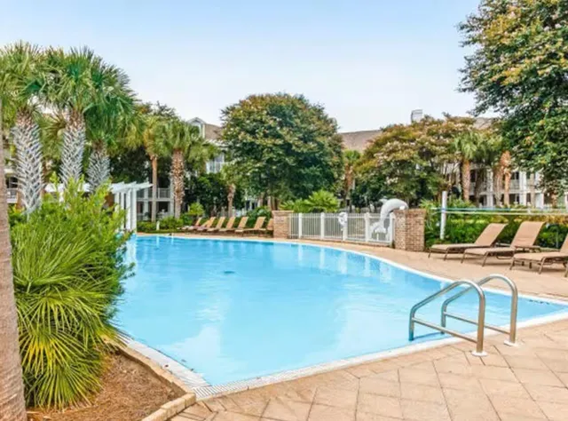 a view of a swimming pool with a lounge chairs