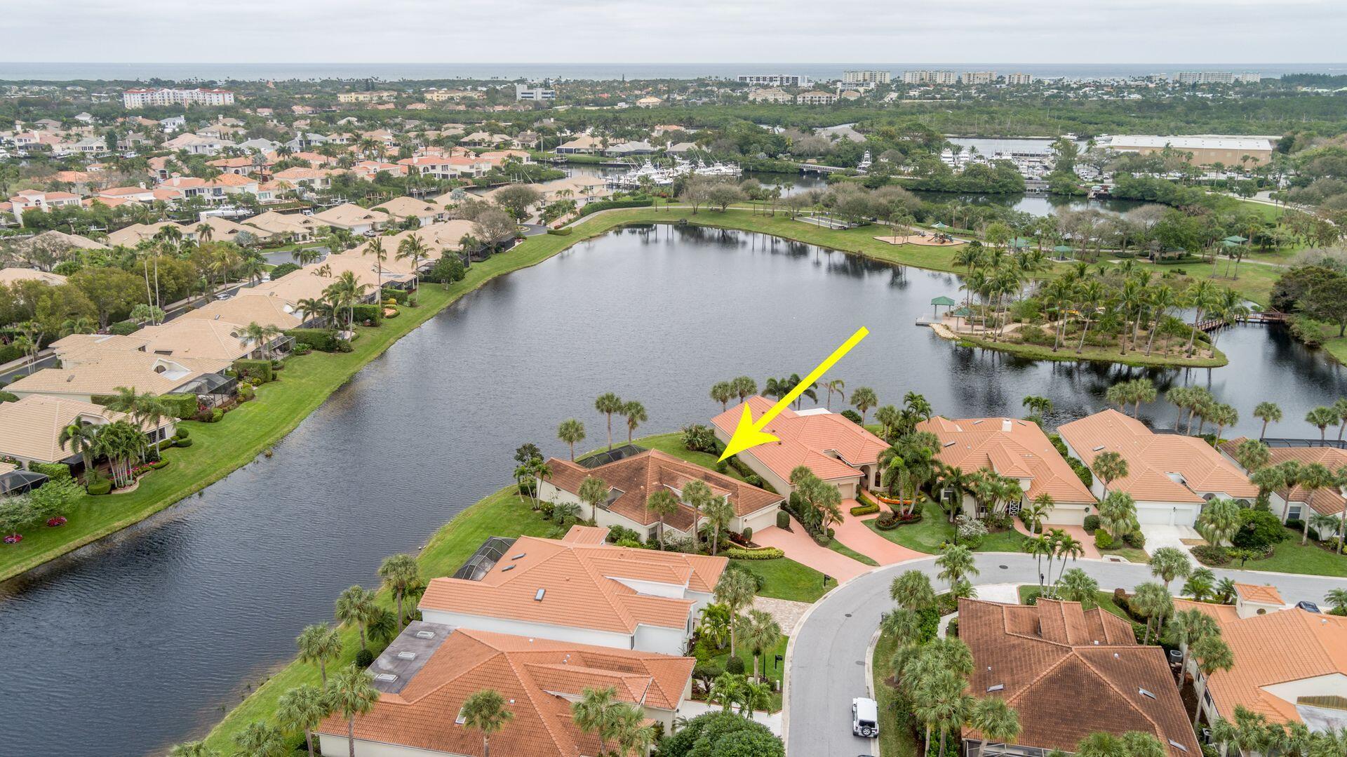 an aerial view of a house with a lake view