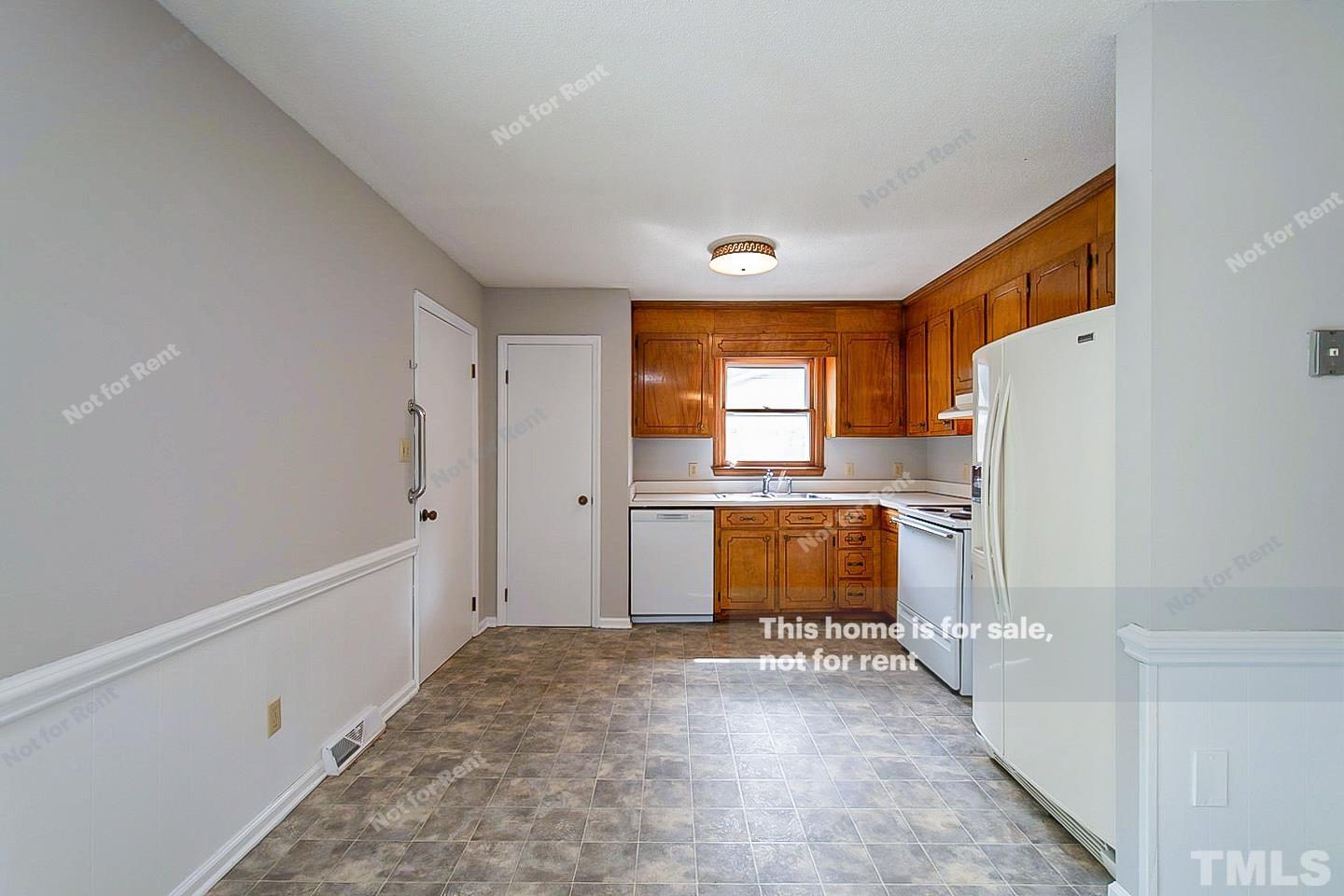 4120 Green Road Raleigh, NC 27604 - Photo 2 of 16 a view of workspace with window and refrigerator