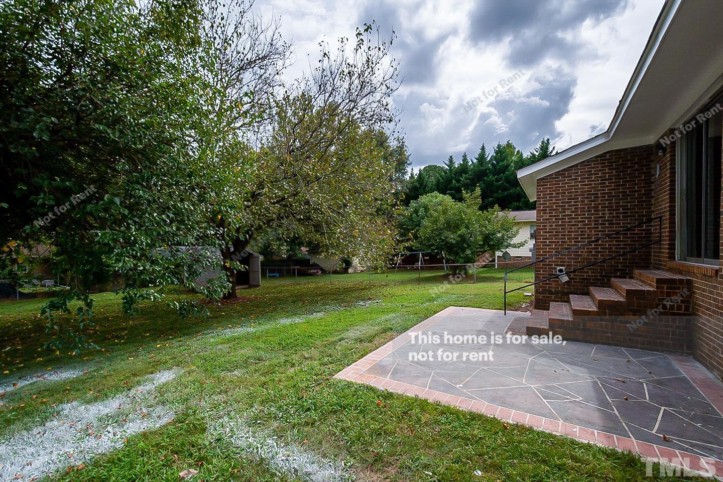 4120 Green Road Raleigh, NC 27604 - Photo 14 of 16 a view of a garden with a slide