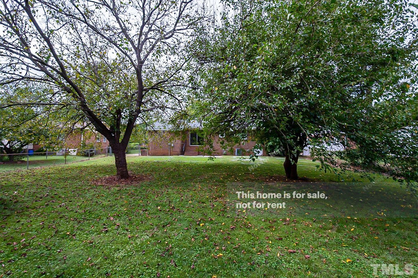 4120 Green Road Raleigh, NC 27604 - Photo 15 of 16 a view of a yard with a tree