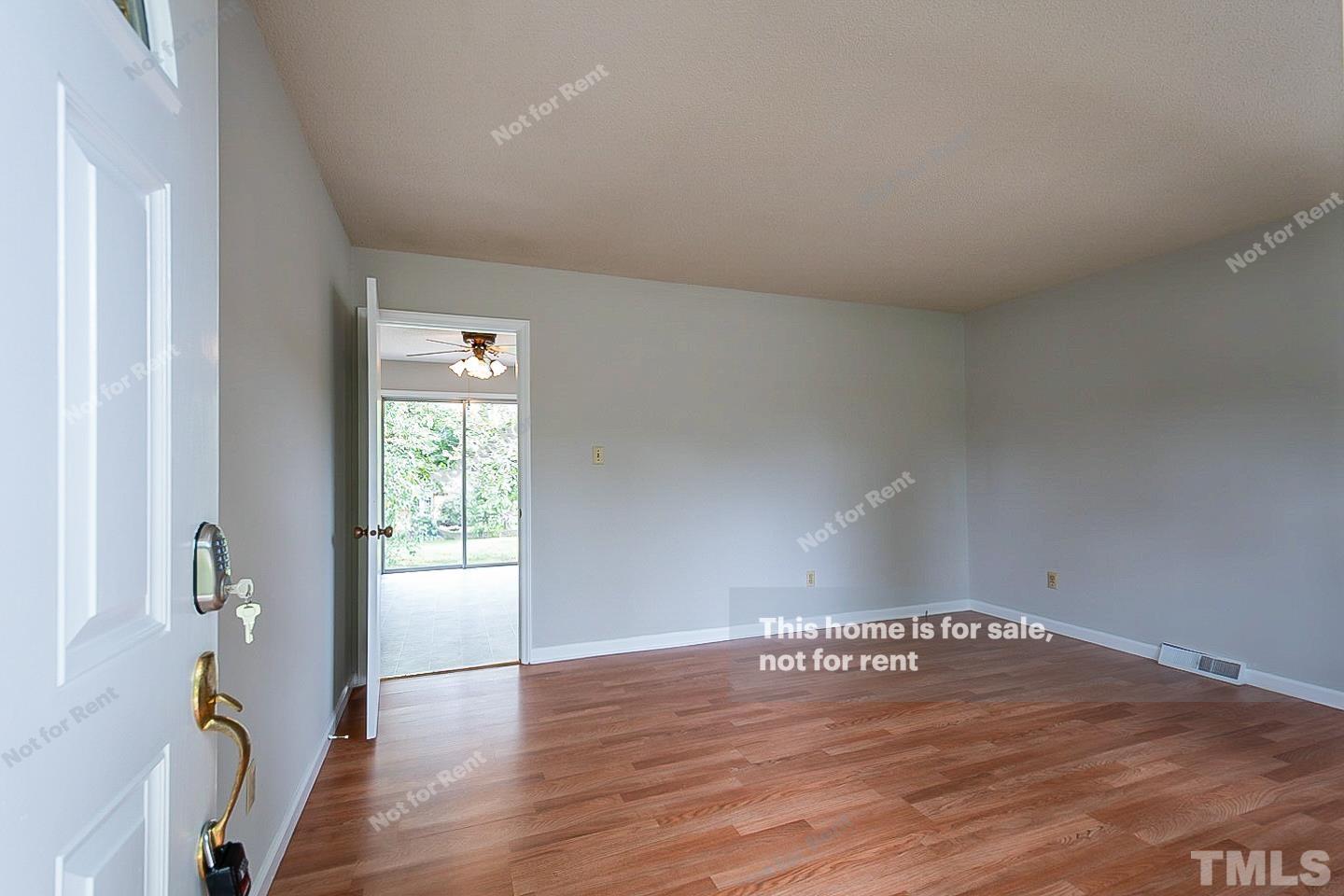 4120 Green Road Raleigh, NC 27604 - Photo 3 of 16 an empty room with wooden floor and windows