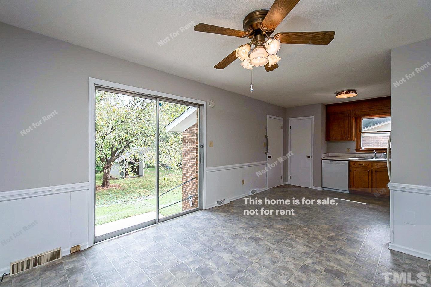 4120 Green Road Raleigh, NC 27604 - Photo 7 of 16 a view of a livingroom with a ceiling fan and window