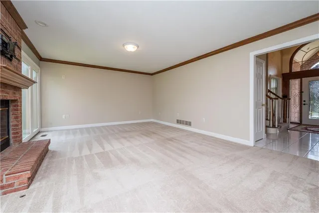 a view of room with window and stairs