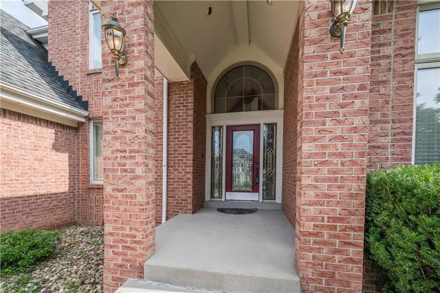 a view of front door of a house with stairs