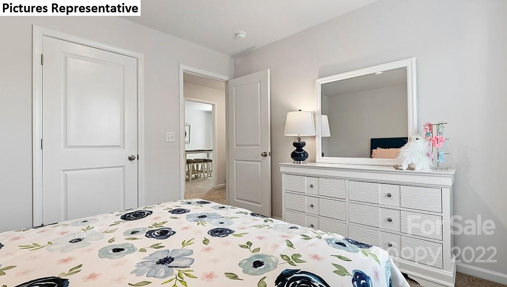 5018 Fandango Road York, SC 29745 - Photo 22 of 29 a bedroom with a bed and a mirror