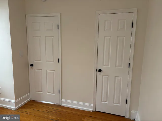 an empty room with wooden floor