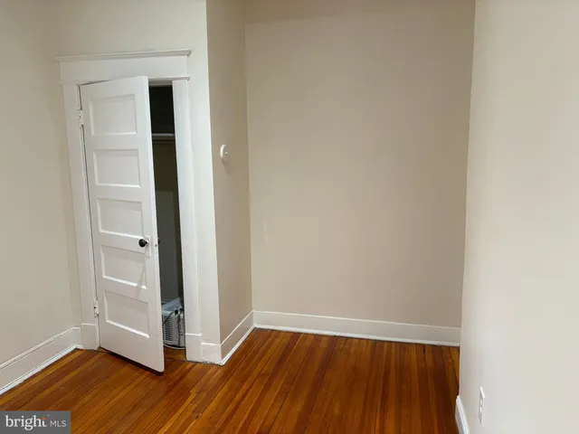 a view of a room with wooden floor and closet