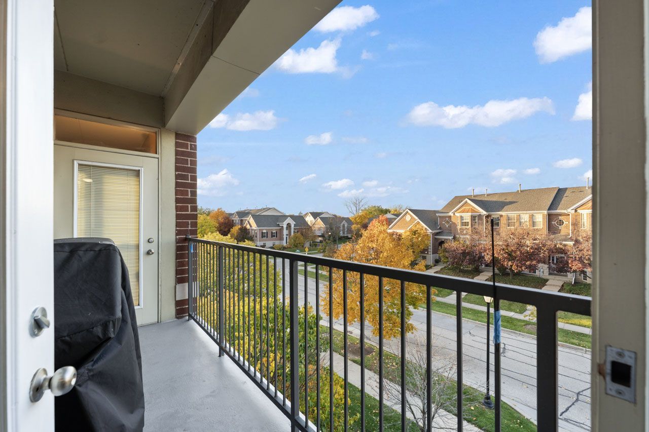 511 Prestwick Lane, Unit 302 Wheeling, IL 60090 - Photo 11 of 24 a view of a balcony with furniture
