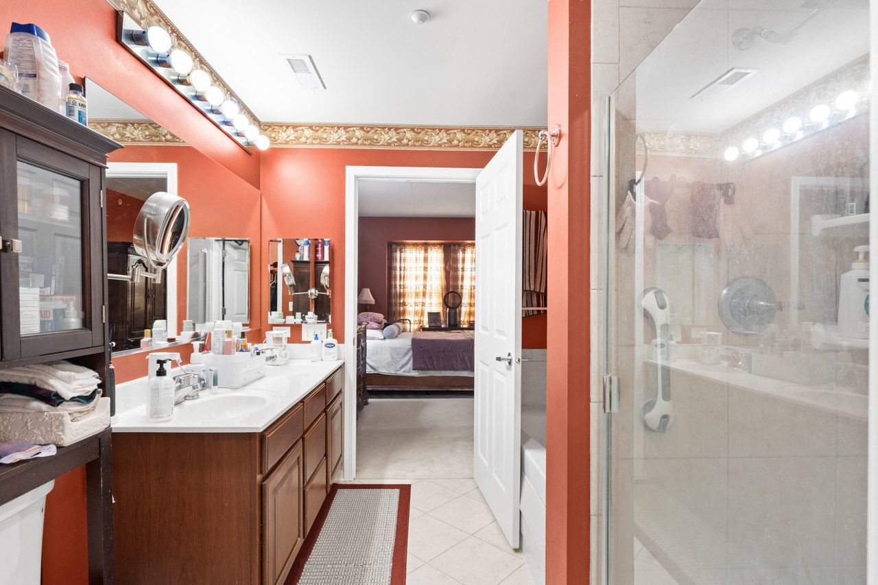 511 Prestwick Lane, Unit 302 Wheeling, IL 60090 - Photo 15 of 24 a bathroom with a double vanity sink mirror and shower