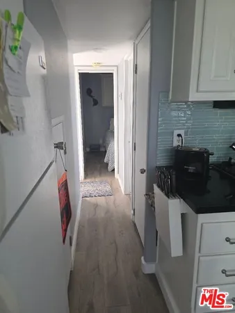 a kitchen with a sink and refrigerator