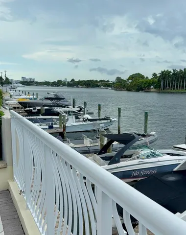 a view of a patio with couches and potted plants