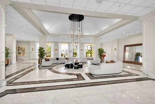 a view of swimming pool with outdoor seating and a buildings in the background