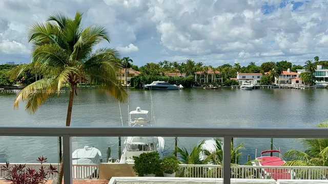 an aerial view of a house with outdoor space and lake view