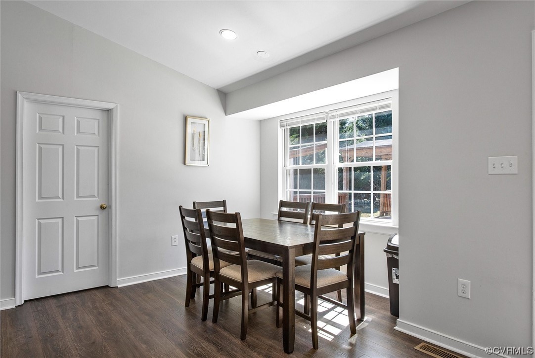8911 Midway Road Henrico, VA 23229 - Photo 13 of 30 a view of a dining room with furniture and wooden floor