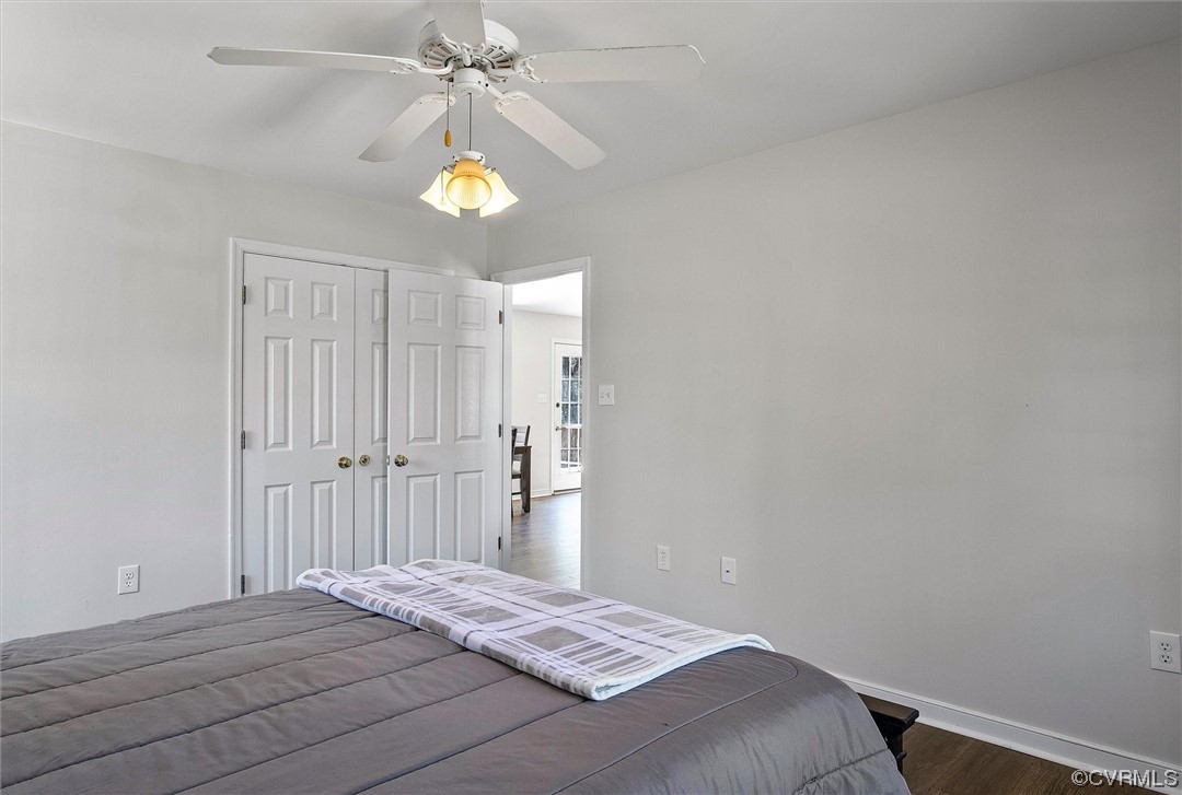 8911 Midway Road Henrico, VA 23229 - Photo 16 of 30 a bedroom with a bed and a chandelier