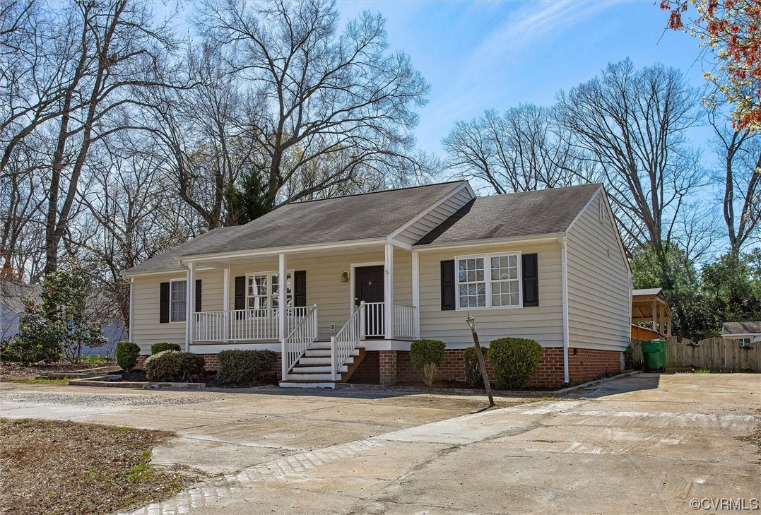 8911 Midway Road Henrico, VA 23229 - Photo 2 of 30 a front view of a house with a yard and garage