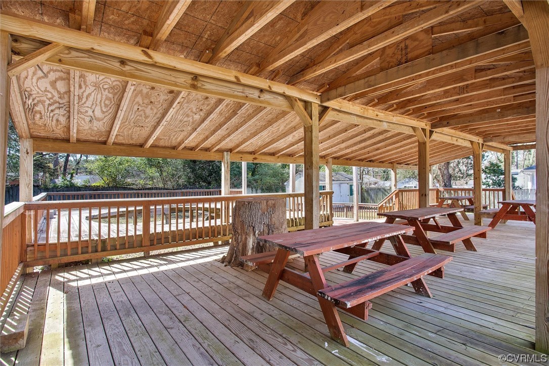 8911 Midway Road Henrico, VA 23229 - Photo 23 of 30 a view of a patio with wooden floor and outdoor seating