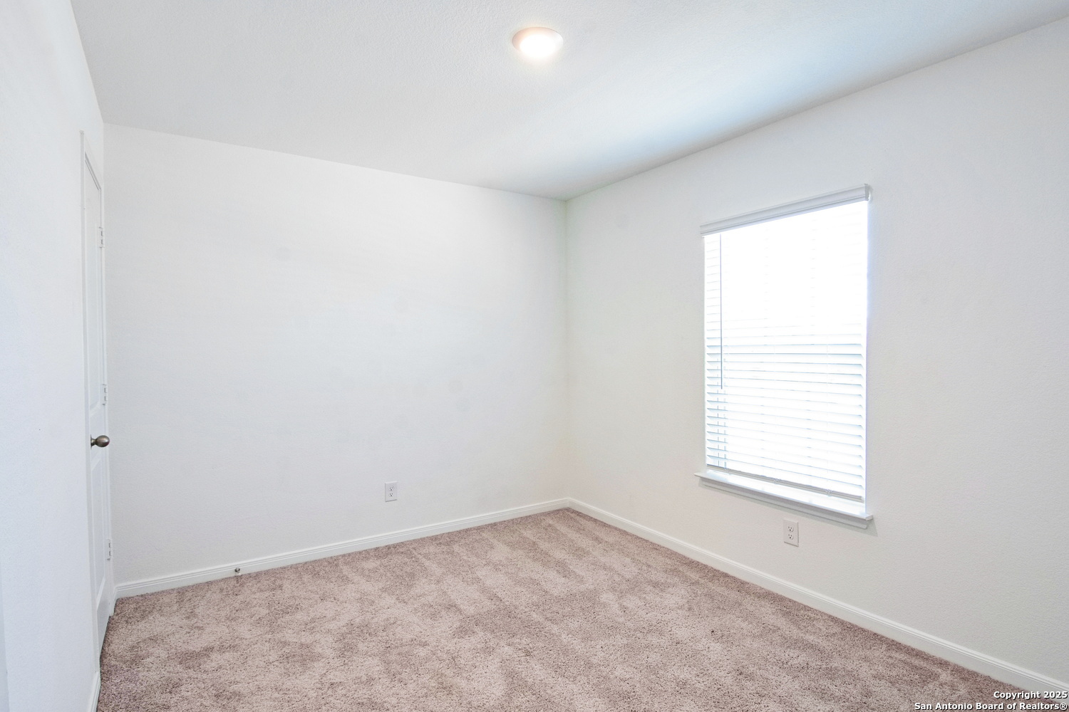 10939 Delight Grove Converse, TX 78109 - Photo 11 of 12 an empty room with a window