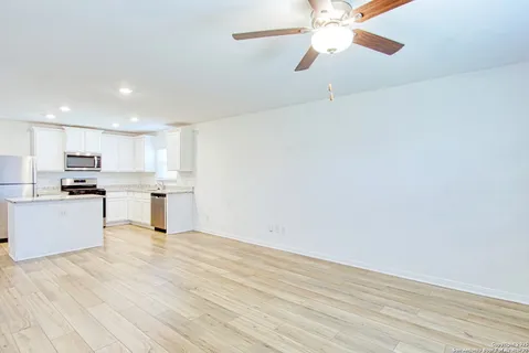 a view of kitchen with wooden floor and window