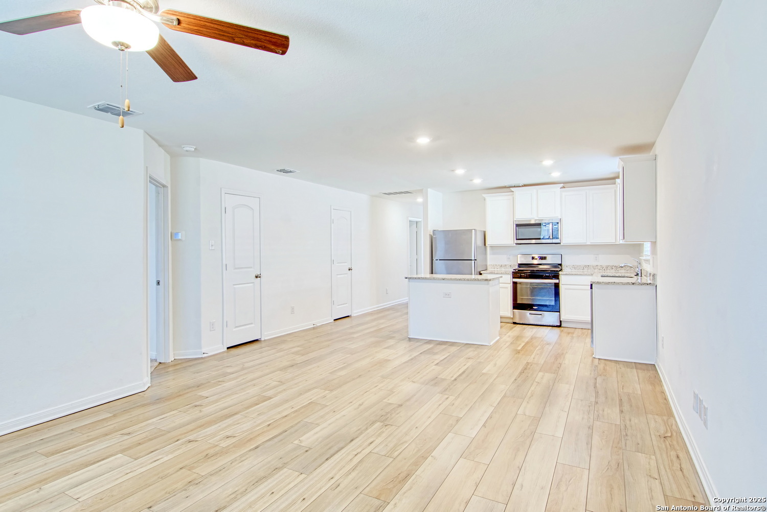 10939 Delight Grove Converse, TX 78109 - Photo 4 of 12 a view of kitchen with wooden floor