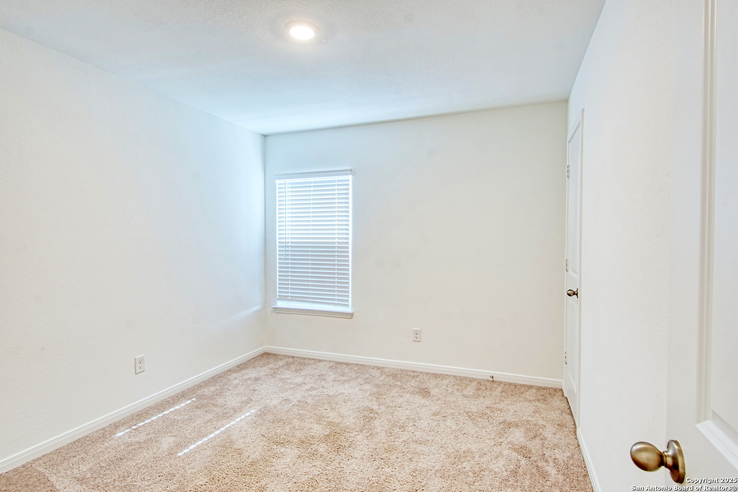 10939 Delight Grove Converse, TX 78109 - Photo 9 of 12 an empty room with a workbench