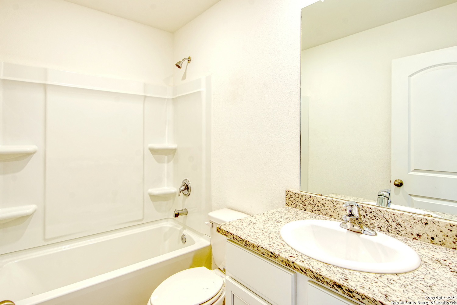 10939 Delight Grove Converse, TX 78109 - Photo 10 of 12 a bathroom with a granite countertop sink toilet and shower