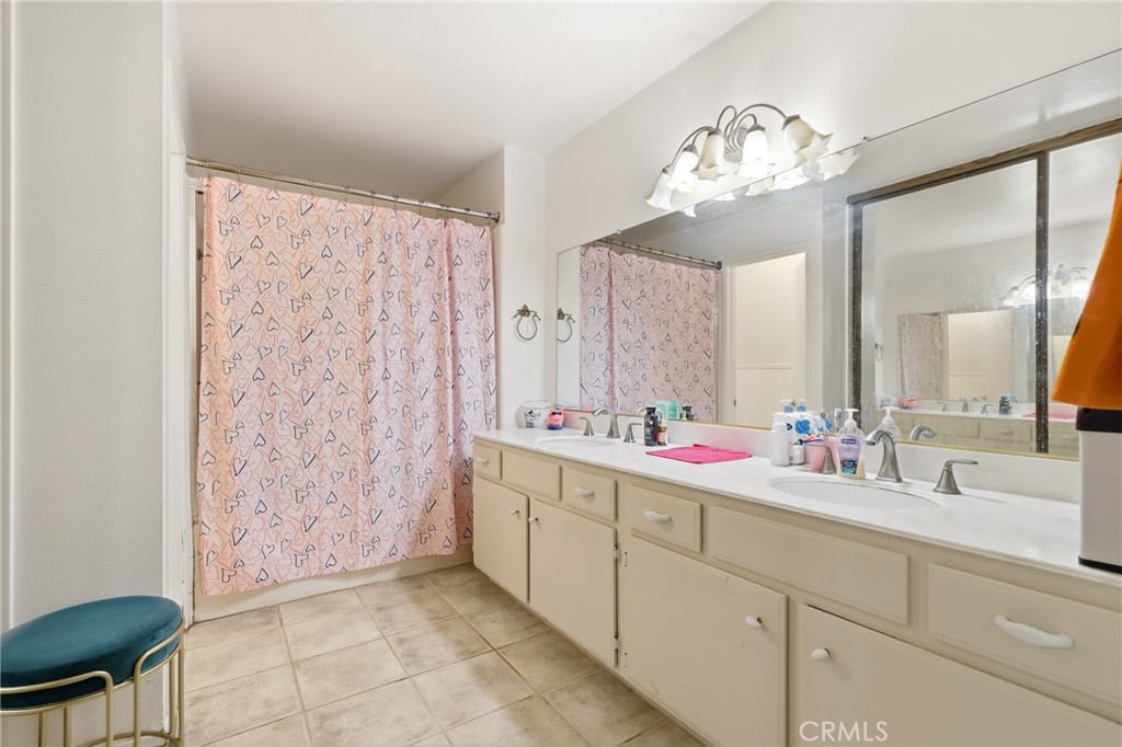 3575 Falconridge Road Yorba Linda, CA 92886 - Photo 16 of 21 a bathroom with a double vanity sink mirror and shower