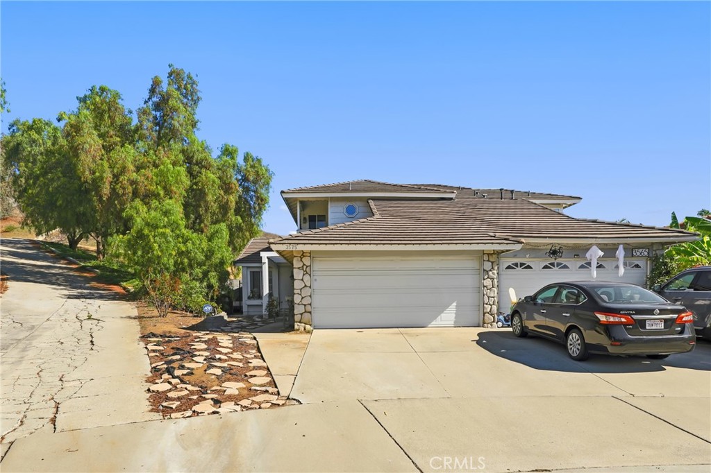 3575 Falconridge Road Yorba Linda, CA 92886 - Photo 2 of 21 a car parked in front of a house