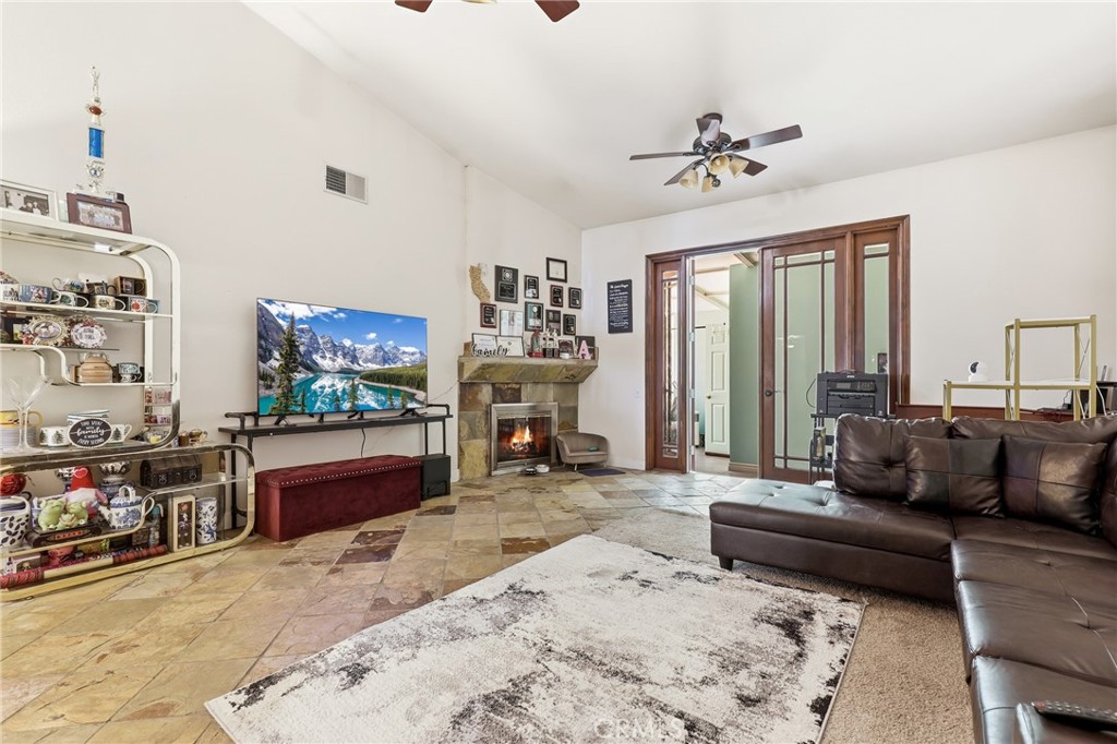 3575 Falconridge Road Yorba Linda, CA 92886 - Photo 3 of 21 a living room with furniture a flat screen tv and a fireplace