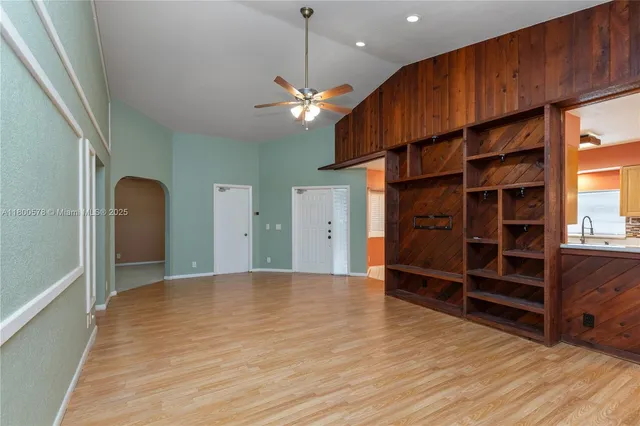 a view of a livingroom with furniture and staircase